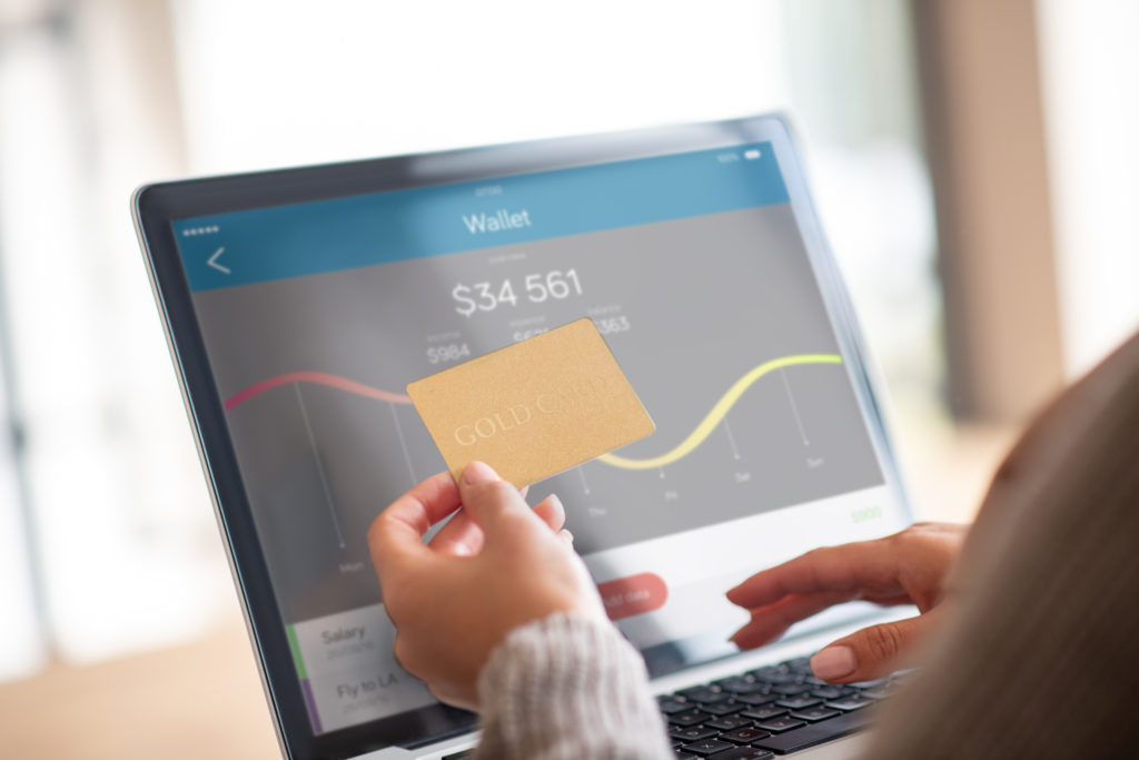 Close Up Of Woman Checking Balance Of Bank Account Online - F1 contabil